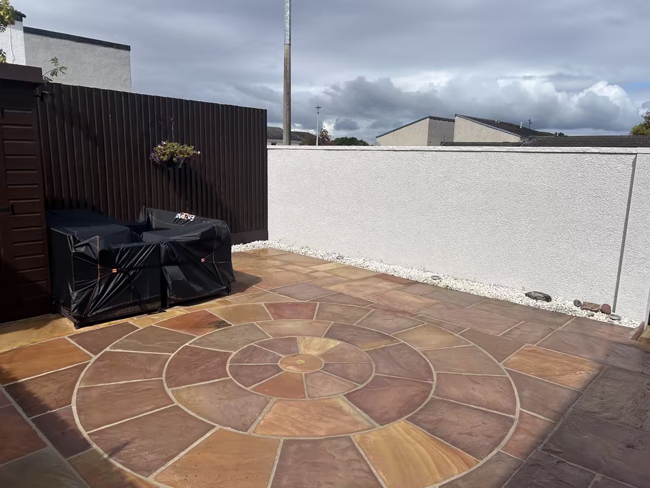 Patio re-pointing Edinburgh - resin jointing compound restoring a circular sandstone patio